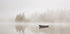 Solitary Boat on a Foggy Lake Plakat - Posterbox.dk